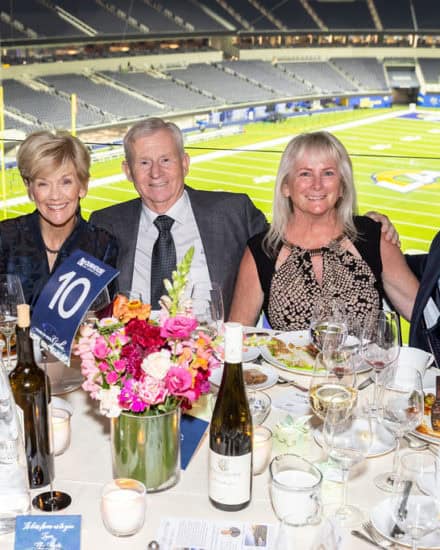 table of guests looking out at the SoFi stadium field