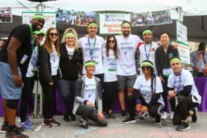 group pic of associate board in running gear