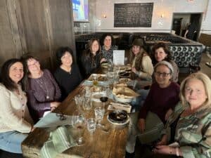 Alumni at a table in a restaurant