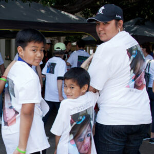 Family participating the the Run for hope, photo of lost loved one on their shirts